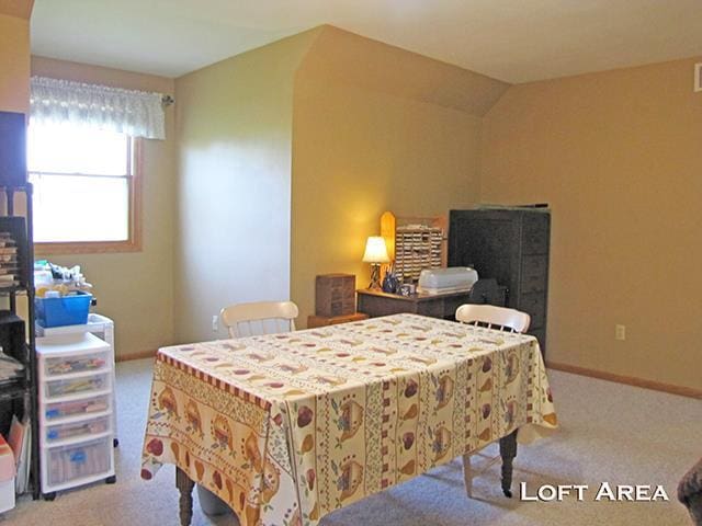 1060 Kamla Ct, Platteville, WI 53818 - carpeted bedroom featuring baseboards and vaulted ceiling