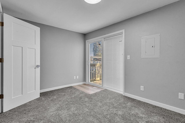 1629 Kentucky Ave, Sheboygan, WI 53081 - unfurnished bedroom with electric panel, access to exterior, carpet floors, and baseboards