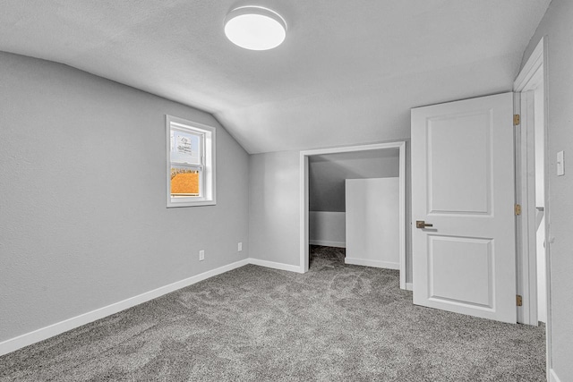 1629 Kentucky Ave, Sheboygan, WI 53081 - bonus room featuring vaulted ceiling, carpet, baseboards, and a textured ceiling