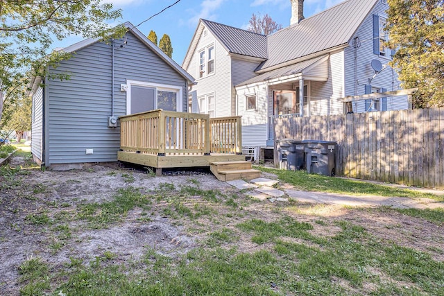 1629 Kentucky Ave, Sheboygan, WI 53081 - rear view of house with a deck, a chimney, and metal roof