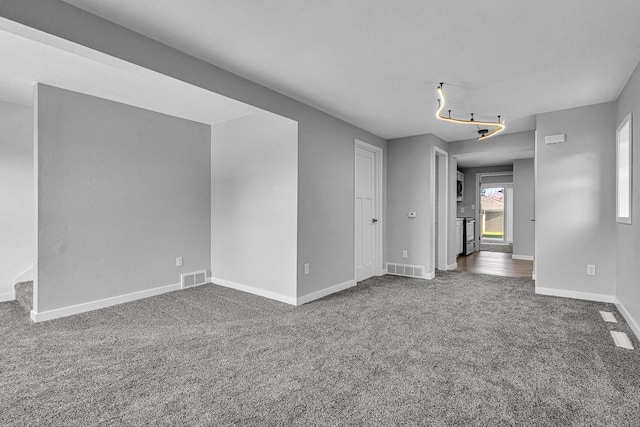 1629 Kentucky Ave, Sheboygan, WI 53081 - spare room featuring dark carpet and baseboards
