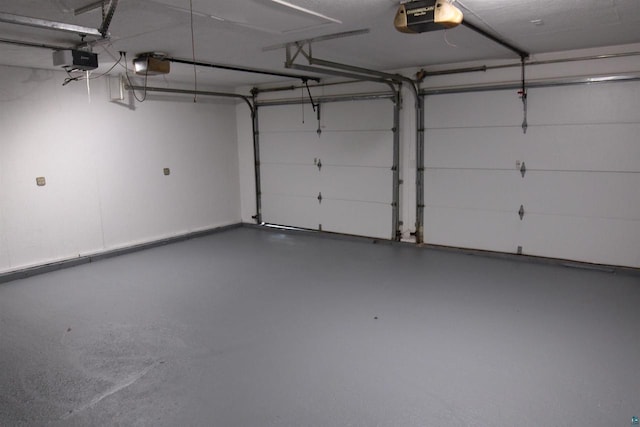 garage featuring a garage door opener