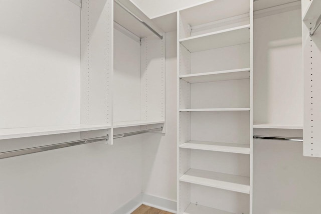 1801 Opus Ln Unit 101, Verona, WI 53593 - walk in closet with wood finished floors