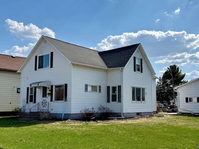 413 E 14th Ave, Ashland, WI 54806 - back of house featuring a lawn and a shingled roof