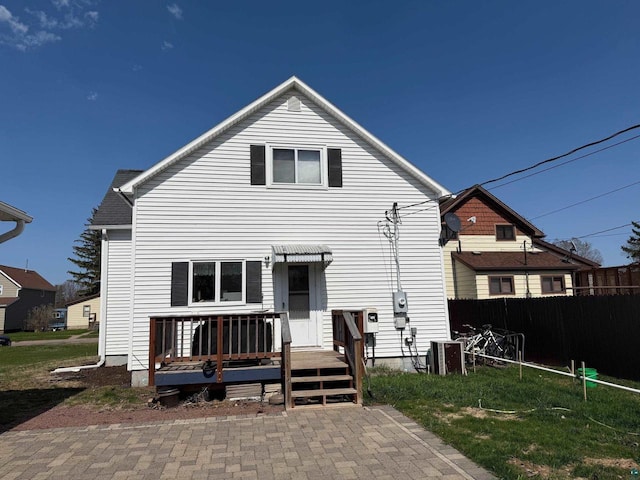 413 E 14th Ave, Ashland, WI 54806 - back of house with fence, cooling unit, and a deck