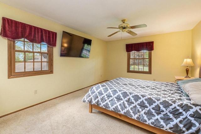 2845 Cambridge Cir, Brookfield, WI 53045 - bedroom featuring multiple windows, carpet flooring, baseboards, and a ceiling fan