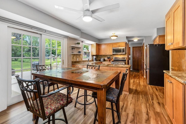 2845 Cambridge Cir, Brookfield, WI 53045 - dining space with a ceiling fan and light wood-style flooring