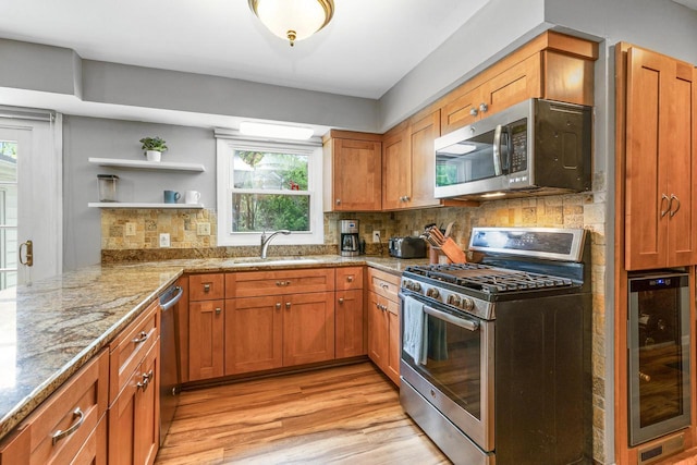 2845 Cambridge Cir, Brookfield, WI 53045 - kitchen with appliances with stainless steel finishes, wine cooler, a sink, light wood-type flooring, and open shelves