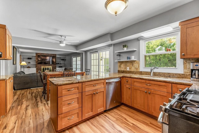 2845 Cambridge Cir, Brookfield, WI 53045 - kitchen featuring dishwasher, a sink, a peninsula, and light wood-style floors