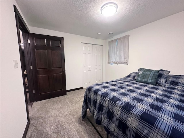 N16298 Fernwall Ave, Stanley, WI 54768 - carpeted bedroom with a textured ceiling, a closet, and baseboards