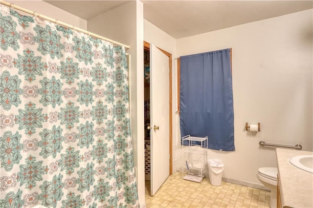 10148 Mcclaine Rd, Hayward, WI 54843 - bathroom with baseboards, vanity, toilet, and a shower with shower curtain
