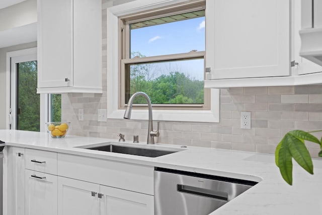 S58W22640 Glengarry Rd, Waukesha, WI 53189 - kitchen featuring dishwasher, a sink, white cabinetry, and backsplash