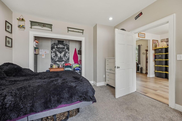 carpeted bedroom with baseboards and recessed lighting