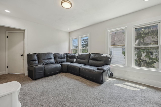living area with carpet flooring, recessed lighting, and baseboards