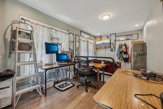 office space with wood finished floors and recessed lighting