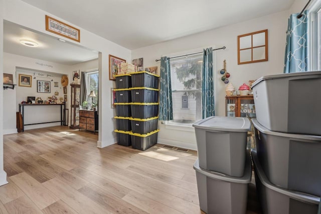 interior space with wood finished floors and baseboards