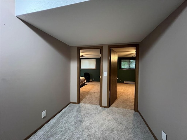 1123 Glades Dr, Altoona, WI 54720 - hall with carpet, a baseboard heating unit, and baseboards