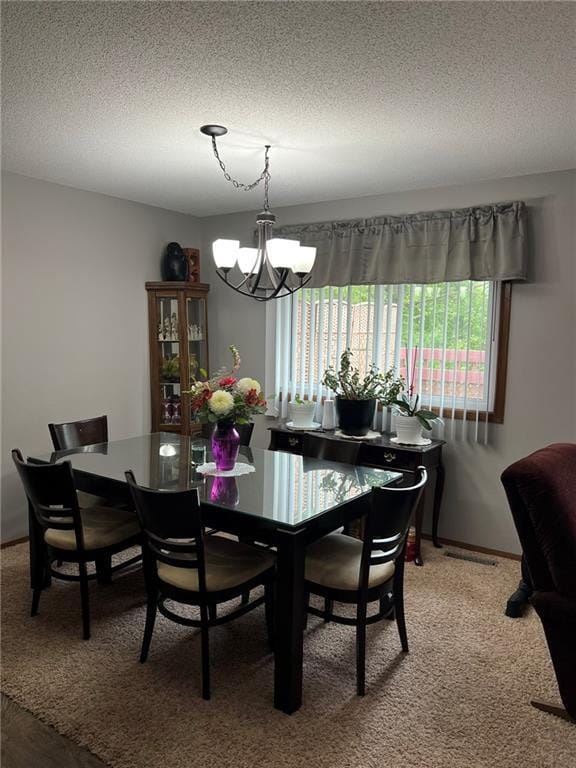 1123 Glades Dr, Altoona, WI 54720 - dining room featuring a chandelier, a textured ceiling, and light colored carpet