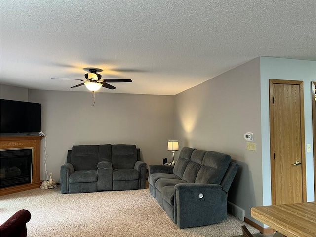 1123 Glades Dr, Altoona, WI 54720 - living area featuring carpet flooring, ceiling fan, a fireplace, and a textured ceiling