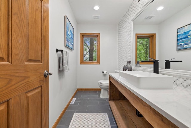 4330 Wilderness Dr, Mount Pleasant, WI 53403 - bathroom with toilet, baseboards, vanity, tile patterned floors, and recessed lighting