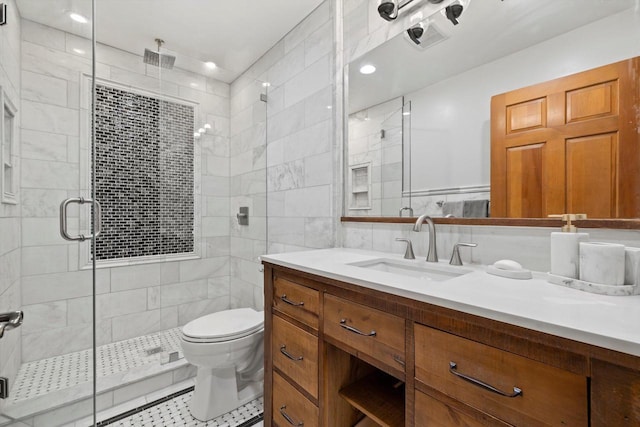 4330 Wilderness Dr, Mount Pleasant, WI 53403 - bathroom featuring vanity, a shower stall, toilet, recessed lighting, and tile walls