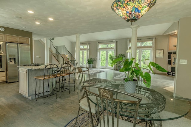 W6504 Klassy Rd, New Glarus, WI 53574 - dining room featuring ornate columns, plenty of natural light, light wood-style floors, and recessed lighting