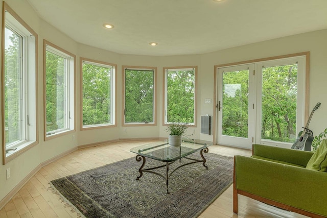 W6504 Klassy Rd, New Glarus, WI 53574 - sunroom featuring healthy amount of natural light, wood-type flooring, a wooden deck, baseboards, and recessed lighting