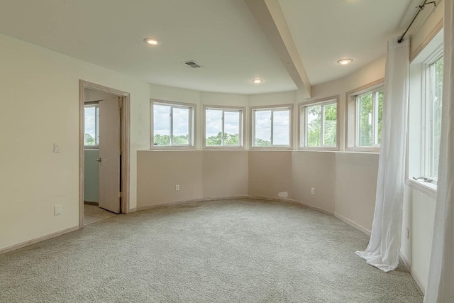 W6504 Klassy Rd, New Glarus, WI 53574 - carpeted empty room featuring healthy amount of natural light, recessed lighting, baseboards, and beamed ceiling