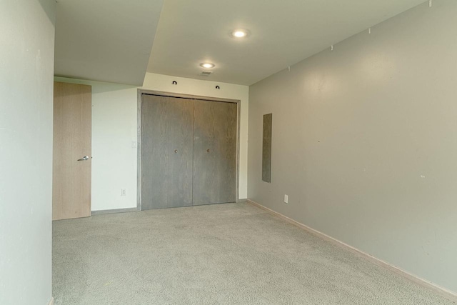 W6504 Klassy Rd, New Glarus, WI 53574 - unfurnished bedroom with carpet, baseboards, a closet, and recessed lighting