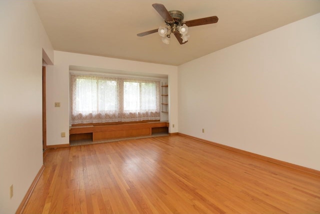 4802 Meredithe Ave, Madison, WI 53716 - empty room featuring light wood-style floors, a ceiling fan, and baseboards