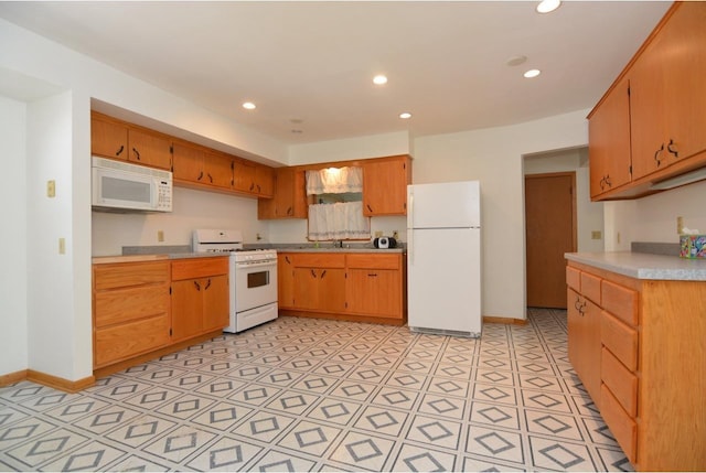 4802 Meredithe Ave, Madison, WI 53716 - kitchen with white appliances, light countertops, recessed lighting, a sink, and baseboards