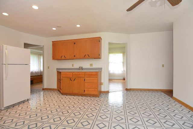 4802 Meredithe Ave, Madison, WI 53716 - kitchen with freestanding refrigerator, a ceiling fan, light countertops, baseboards, and recessed lighting