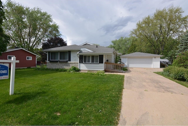 4802 Meredithe Ave, Madison, WI 53716 - view of front of property with a garage, an outbuilding, and a front yard