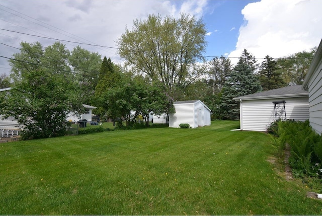 4802 Meredithe Ave, Madison, WI 53716 - view of green lawn featuring a storage shed and an outdoor structure