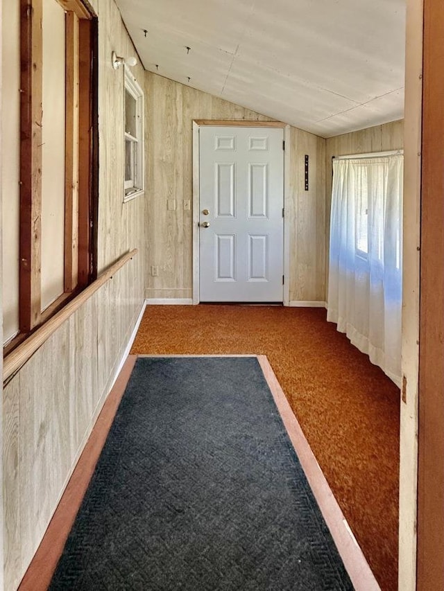 4802 Meredithe Ave, Madison, WI 53716 - hallway with lofted ceiling, carpet flooring, and wooden walls