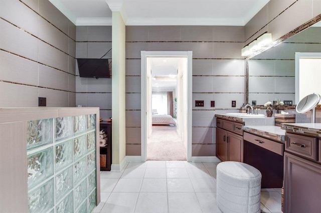 9121 Blackhawk Rd, Middleton, WI 53562 - ensuite bathroom featuring crown molding, vanity, and tile patterned flooring