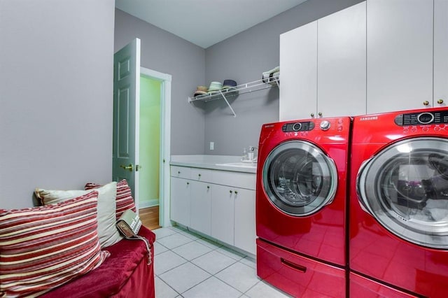 9121 Blackhawk Rd, Middleton, WI 53562 - laundry area with cabinet space, washer and dryer, and light tile patterned floors