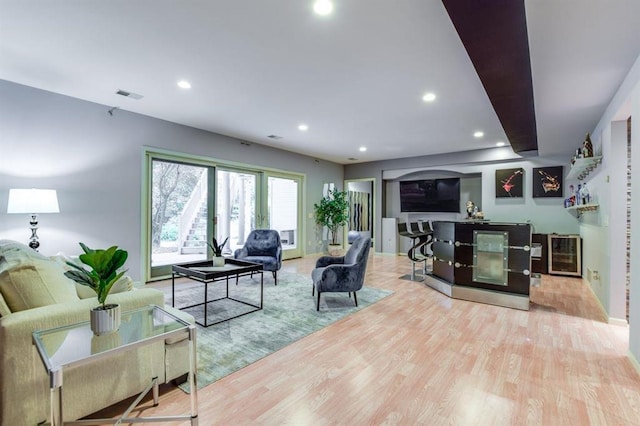 9121 Blackhawk Rd, Middleton, WI 53562 - living room with wood finished floors, recessed lighting, wine cooler, and baseboards