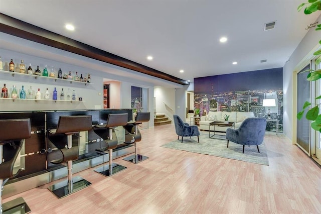 9121 Blackhawk Rd, Middleton, WI 53562 - indoor dry bar with wood finished floors, stairs, and recessed lighting