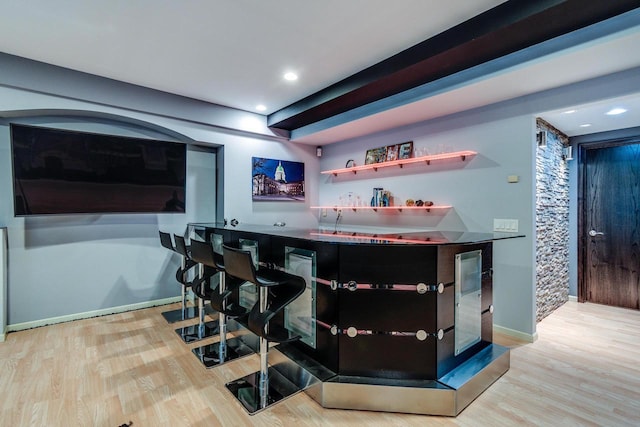 9121 Blackhawk Rd, Middleton, WI 53562 - indoor bar with wood finished floors, baseboards, and recessed lighting