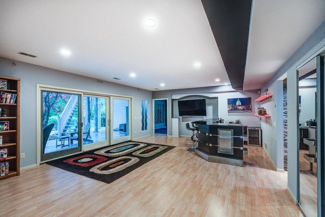 9121 Blackhawk Rd, Middleton, WI 53562 - living room featuring wood finished floors, baseboards, and recessed lighting