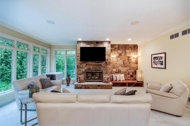 9121 Blackhawk Rd, Middleton, WI 53562 - living room with light colored carpet, crown molding, a fireplace, and recessed lighting