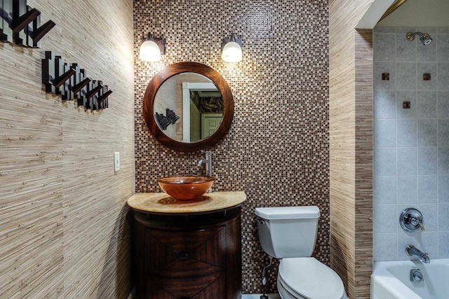 9121 Blackhawk Rd, Middleton, WI 53562 - bathroom featuring tile walls, toilet, shower / washtub combination, and vanity