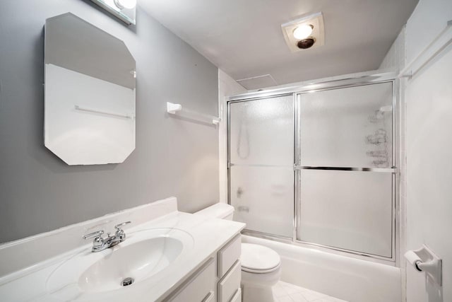 8735 N 72nd St Unit 202, Milwaukee, WI 53223 - bathroom featuring toilet, vanity, and shower / bath combination with glass door