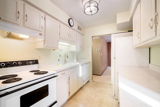 8735 N 72nd St Unit 202, Milwaukee, WI 53223 - kitchen featuring white appliances, under cabinet range hood, light countertops, and white cabinetry