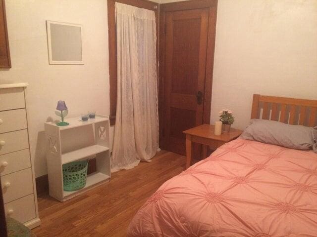 bedroom with wood finished floors