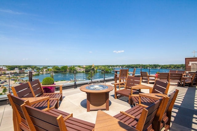 215 E Pleasant St Unit 201, Oconomowoc, WI 53066 - view of patio with a water view