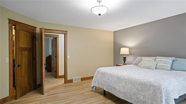 E3313 Jennifer Ln, Eau Claire, WI 54701 - bedroom featuring light wood-type flooring and baseboards