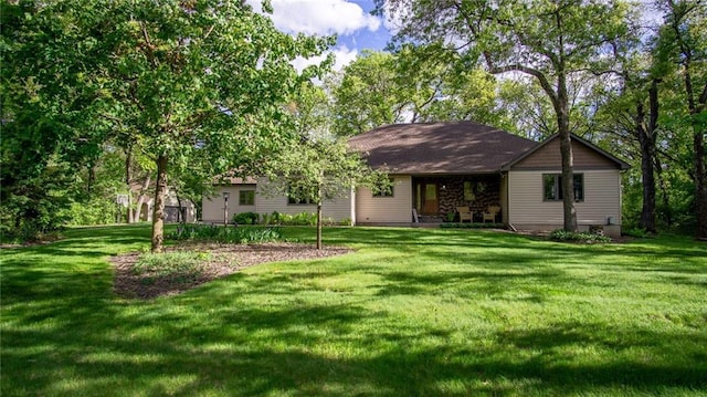 E3313 Jennifer Ln, Eau Claire, WI 54701 - rear view of house with a lawn