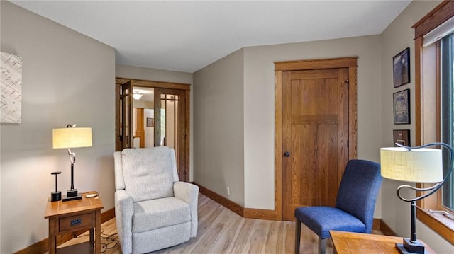 E3313 Jennifer Ln, Eau Claire, WI 54701 - sitting room with light wood-style floors and baseboards